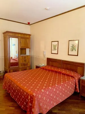 Letto o letti in una camera di Hotel La Calcina