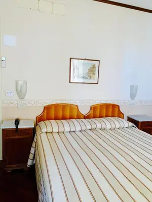 Letto o letti in una camera di Hotel La Calcina