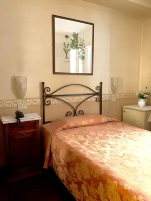 Letto o letti in una camera di Hotel La Calcina