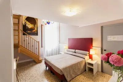 Letto o letti in una camera di Foresteria Levi