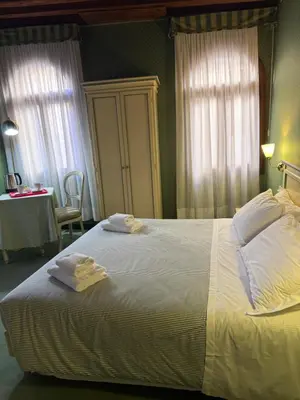 Letto o letti in una camera di Locanda Ruga Rialto
