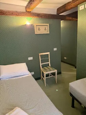 Letto o letti in una camera di Locanda Ruga Rialto