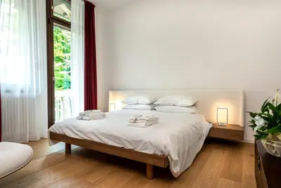 Letto o letti in una camera di Villa Gallo 1915, luxurious villa with garden and SPA