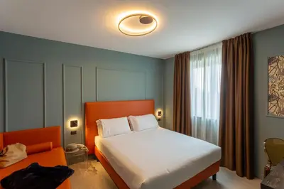 Letto o letti in una camera di Hotel Ambra