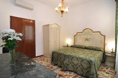 Letto o letti in una camera di Smeraldo apartment Grand Canal 1566C