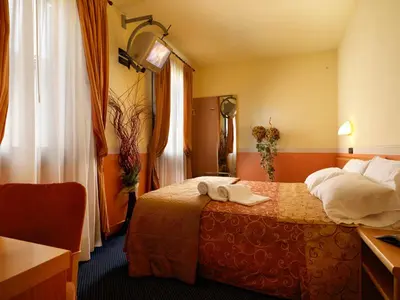 Letto o letti in una camera di Hotel & Residence Roma