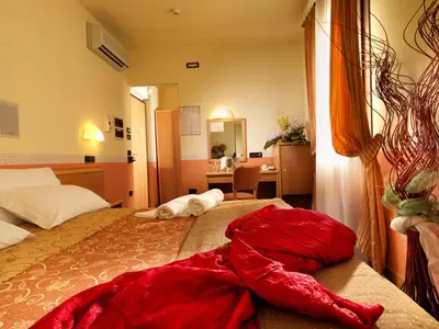 Letto o letti in una camera di Hotel & Residence Roma