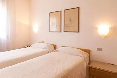 Letto o letti in una camera di Hotel Due Mori