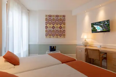 Letto o letti in una camera di Art&Park Hotel Union Lido