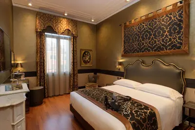 Letto o letti in una camera di UNAHOTELS Ala Venezia-Adults 16