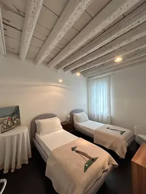 Letto o letti in una camera di Ada Canal House VISTA CANALE