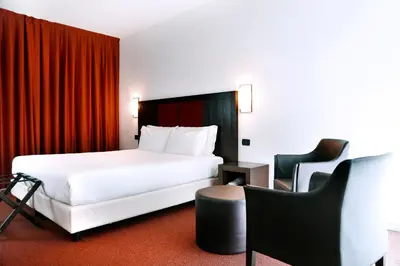 Letto o letti in una camera di Hotel Holiday La Marca