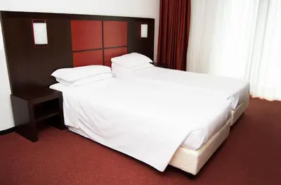 Letto o letti in una camera di Hotel Holiday La Marca
