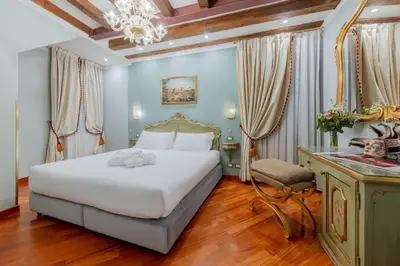 Letto o letti in una camera di Cà dell'arte Suite