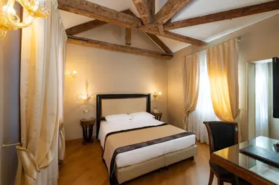 Letto o letti in una camera di Hotel Paganelli