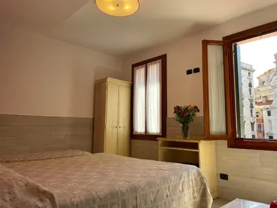 Letto o letti in una camera di Hotel San Geremia