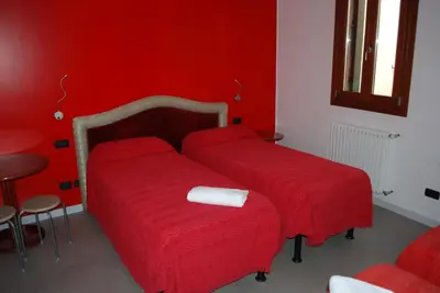 Letto o letti in una camera di Hotel San Geremia