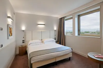 Letto o letti in una camera di Hotel Plaza