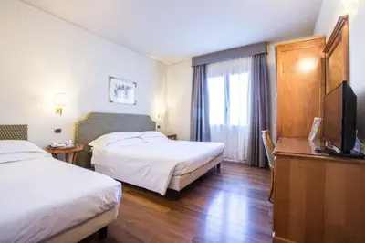 Letto o letti in una camera di Hotel Plaza