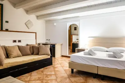 Letto o letti in una camera di B&B Hotel Roy