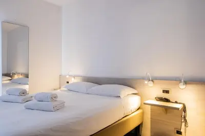 Letto o letti in una camera di B&B Hotel Roy