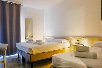 Letto o letti in una camera di B&B Hotel Roy