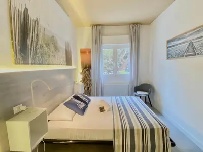 Letto o letti in una camera di Civico 148- Lido di Jesolo - Per Famiglie