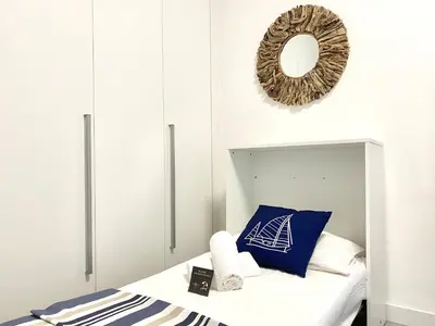 Letto o letti in una camera di Civico 148- Lido di Jesolo - Per Famiglie