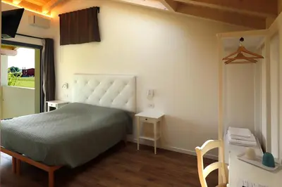 Letto o letti in una camera di B&B Ca' del Portego