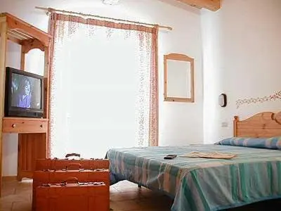 Letto o letti in una camera di Hotel Garni Tosca