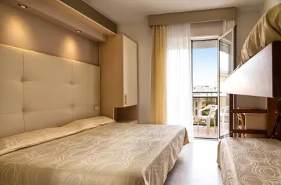 Letto o letti in una camera di Hotel Torino