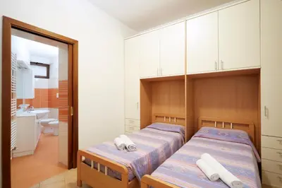 Letto o letti in una camera di Collegio AMDG