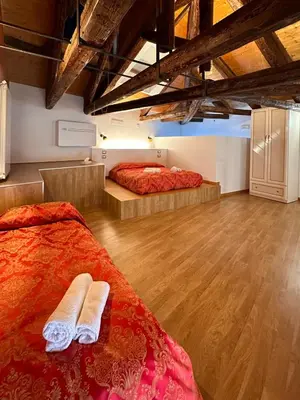 Letto o letti in una camera di Collegio AMDG