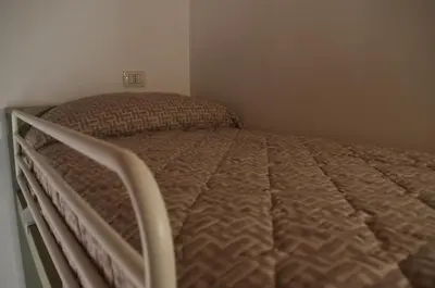 Letto o letti in una camera di Golf Jesolo Village ➔ Attico con Piscina