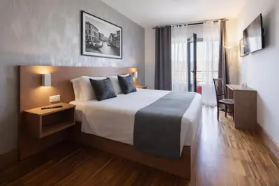Letto o letti in una camera di Torre Antica Venice Airport Hotel