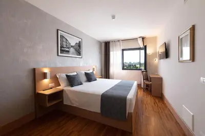 Letto o letti in una camera di Torre Antica Venice Airport Hotel