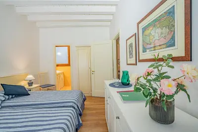 Letto o letti in una camera di Ca' Dei Musicanti 1 Few Steps from Rialto Bridge!