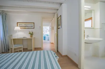 Letto o letti in una camera di Ca' Dei Musicanti 2 Few Steps from Rialto Bridge!