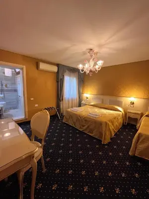 Letto o letti in una camera di Hotel Castello