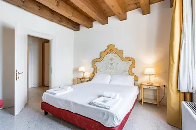 Letto o letti in una camera di Molino Stucky Residence Burchiello Suite