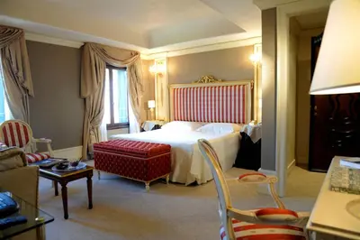 Letto o letti in una camera di Ca' Sagredo Hotel