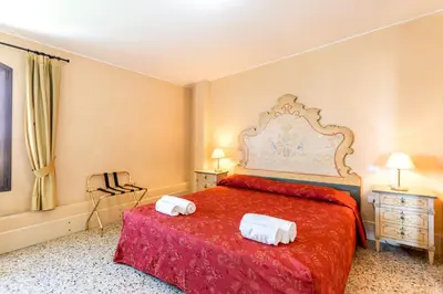 Letto o letti in una camera di Molino Stucky Residence Bragosso