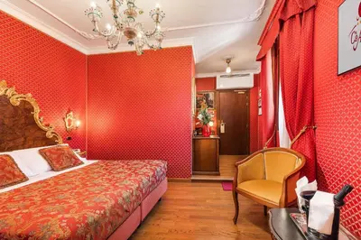 Letto o letti in una camera di Hotel Ca' Alvise