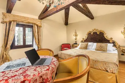 Letto o letti in una camera di Hotel Ca' Alvise