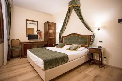 Letto o letti in una camera di Residenza Rivo Alto