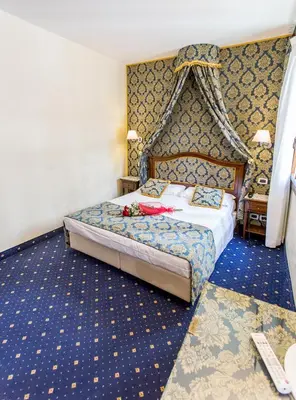 Letto o letti in una camera di Residenza Rivo Alto