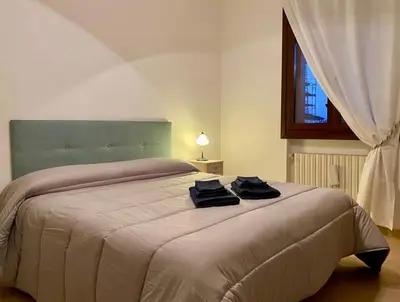 Letto o letti in una camera di Casa Ester
