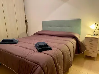 Letto o letti in una camera di Casa Ester