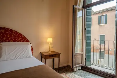 Letto o letti in una camera di Ca' Turelli Dimora Storica
