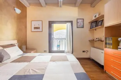 Letto o letti in una camera di Residence dei Frutti in pieno centro - Il Gelso